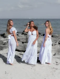 Family of four enjoying the beach in Playa del Carmen during a professional family photography session in Mexico