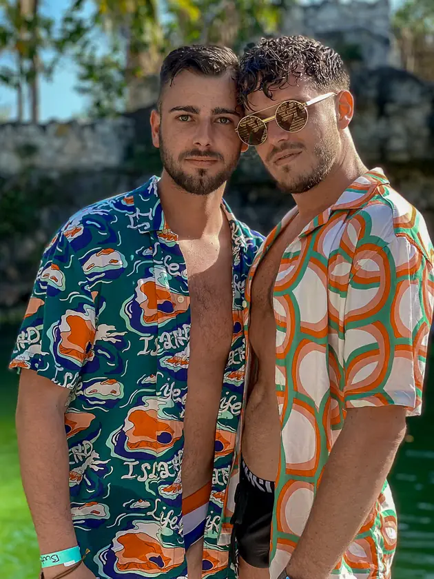 Gay couple embracing during a same-sex proposal photography session at Mayan ruins in Playa del Carmen